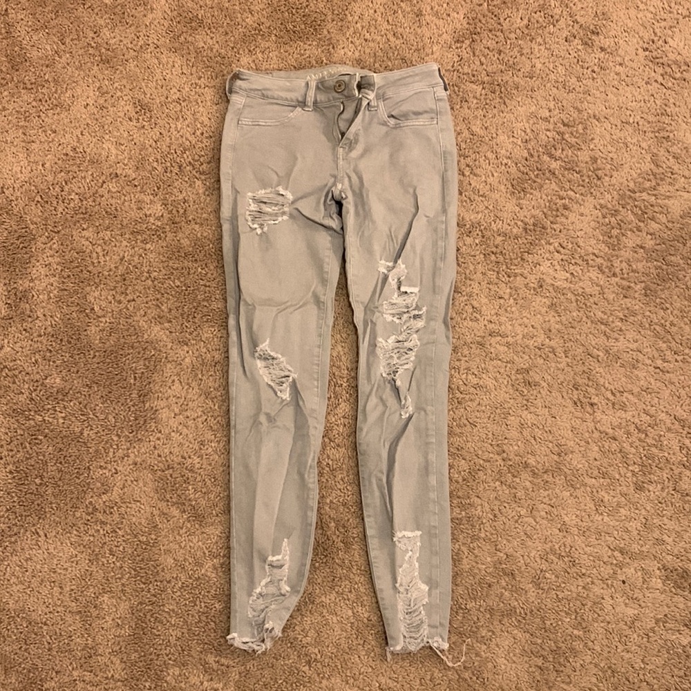 Grey ripped skinny jeans